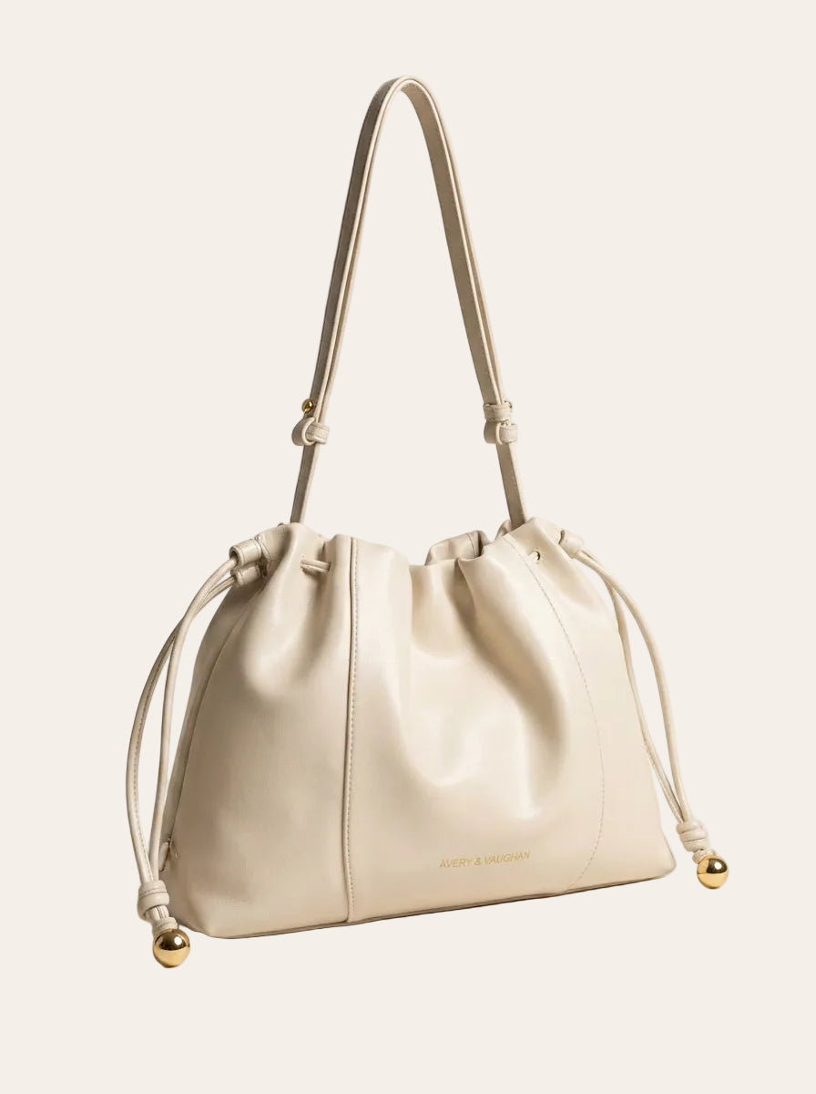 The Camellia Drawstring Shoulder Bag – Soft Ivory – 3/4 angle